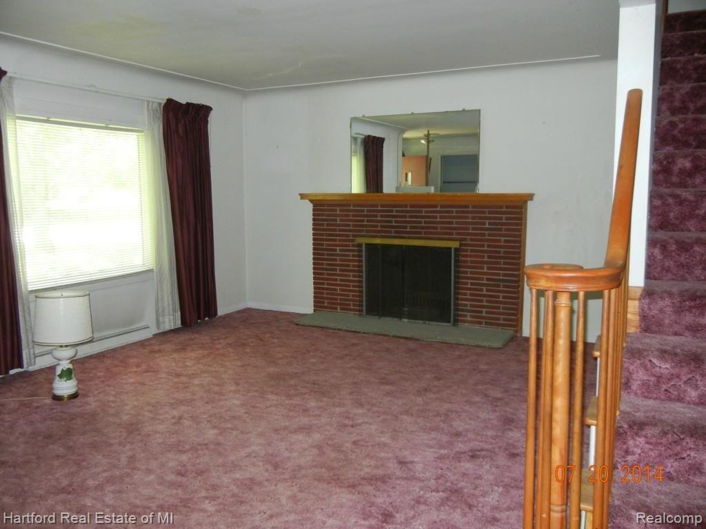 26120 Springland Street Farmington, MI 48334 - Photo 11 of 28 Livingroom with natural fireplace