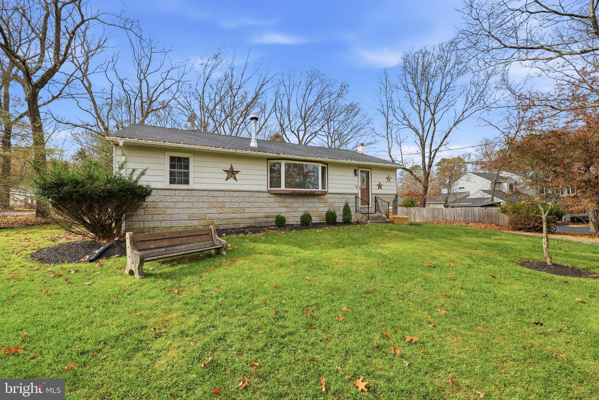 7 Anne Drive Tabernacle, NJ 08088 - Photo 2 of 44 a backyard of a house with table and chairs plants and large tree