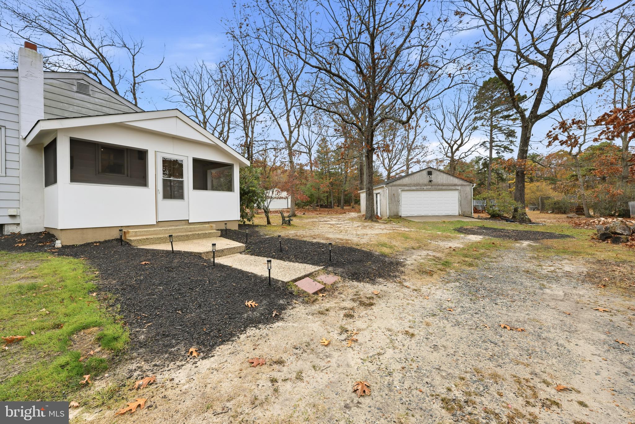 7 Anne Drive Tabernacle, NJ 08088 - Photo 28 of 44 a view of a white house with a yard covered with snow