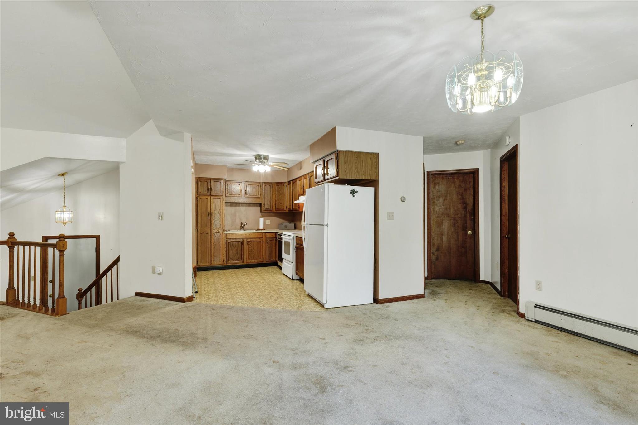 523 River Road Delta, PA 17314 - Photo 9 of 27 a view of a hallway with entryway and chandelier
