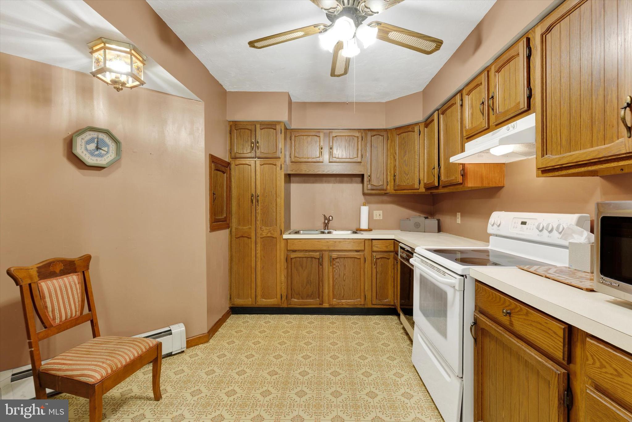 523 River Road Delta, PA 17314 - Photo 10 of 27 a kitchen with a refrigerator and a stove
