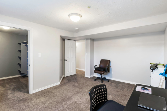 13176 Day Court Draper, UT 84020 - Photo 31 of 45 Home office with dark colored carpet and baseboards