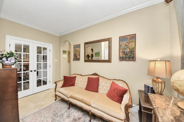 a bedroom with two beds and a large window