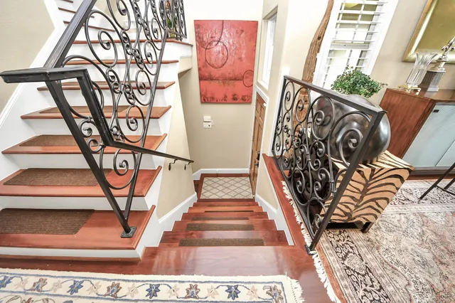 a kitchen with sink stove and cabinets