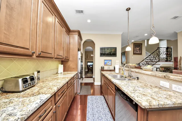 a bedroom with furniture large window and a flat screen tv