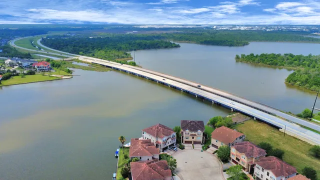 a view of barbeque grill with wooden floor and fence