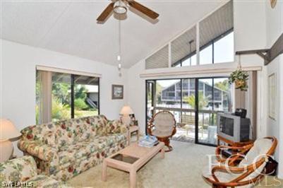 978 Sand Castle Road Sanibel, FL 33957 - Photo 2 of 10 a living room with furniture and a large window