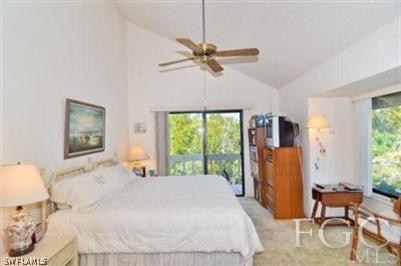 978 Sand Castle Road Sanibel, FL 33957 - Photo 5 of 10 a bedroom with a bed and a chandelier