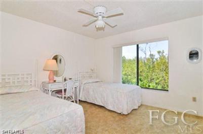 978 Sand Castle Road Sanibel, FL 33957 - Photo 6 of 10 a bedroom with a bed and window