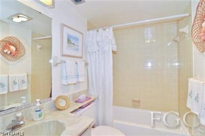 978 Sand Castle Road Sanibel, FL 33957 - Photo 7 of 10 a bathroom with a sink toilet tub and shower