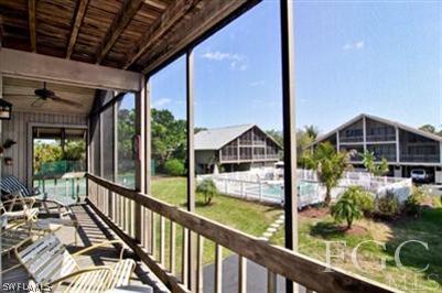 978 Sand Castle Road Sanibel, FL 33957 - Photo 10 of 10 a view of a porch with furniture and garden view