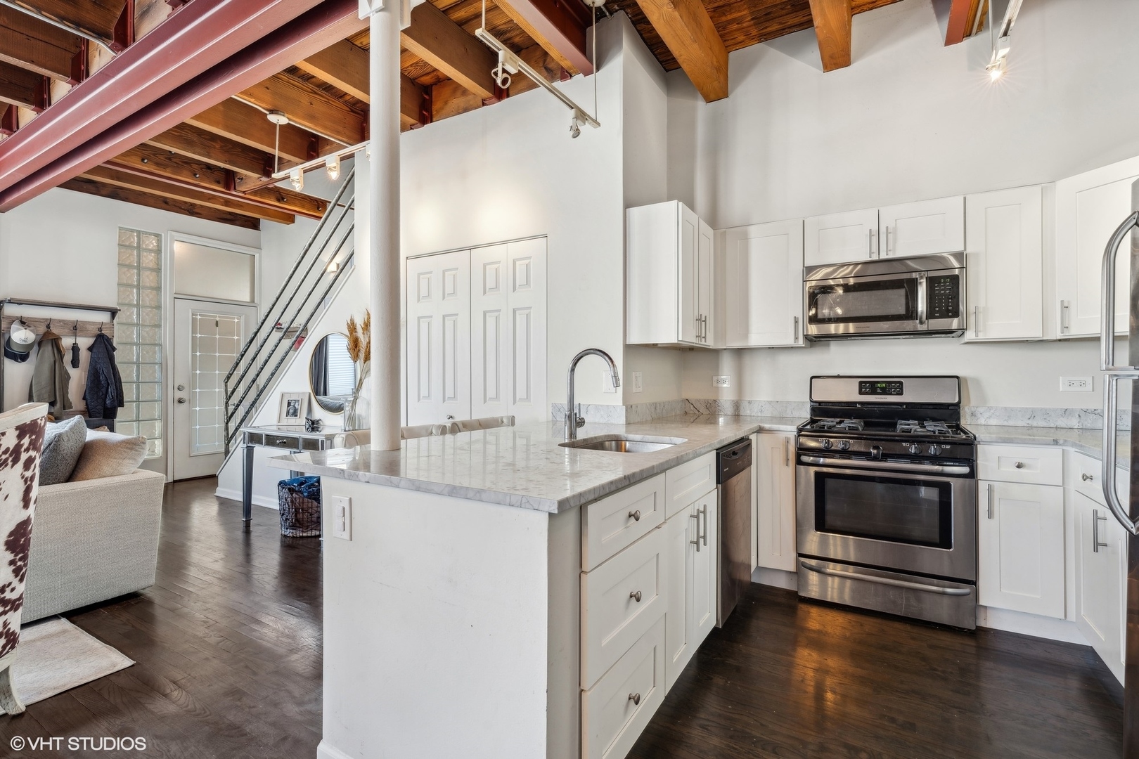 1235 West George Street, Unit 215 Chicago, IL 60657 - Photo 12 of 25 a kitchen with stainless steel appliances granite countertop a stove and a sink