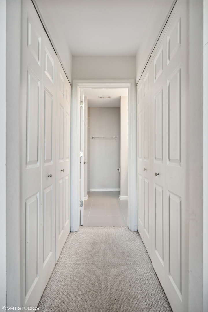1235 West George Street, Unit 215 Chicago, IL 60657 - Photo 15 of 25 a view of a hallway with wooden floor