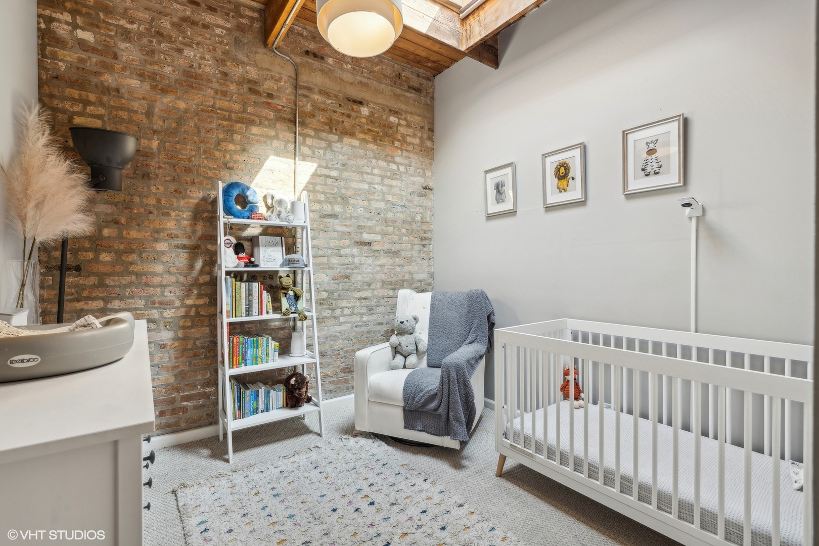 1235 West George Street, Unit 215 Chicago, IL 60657 - Photo 19 of 25 a bedroom with furniture and a book shelf