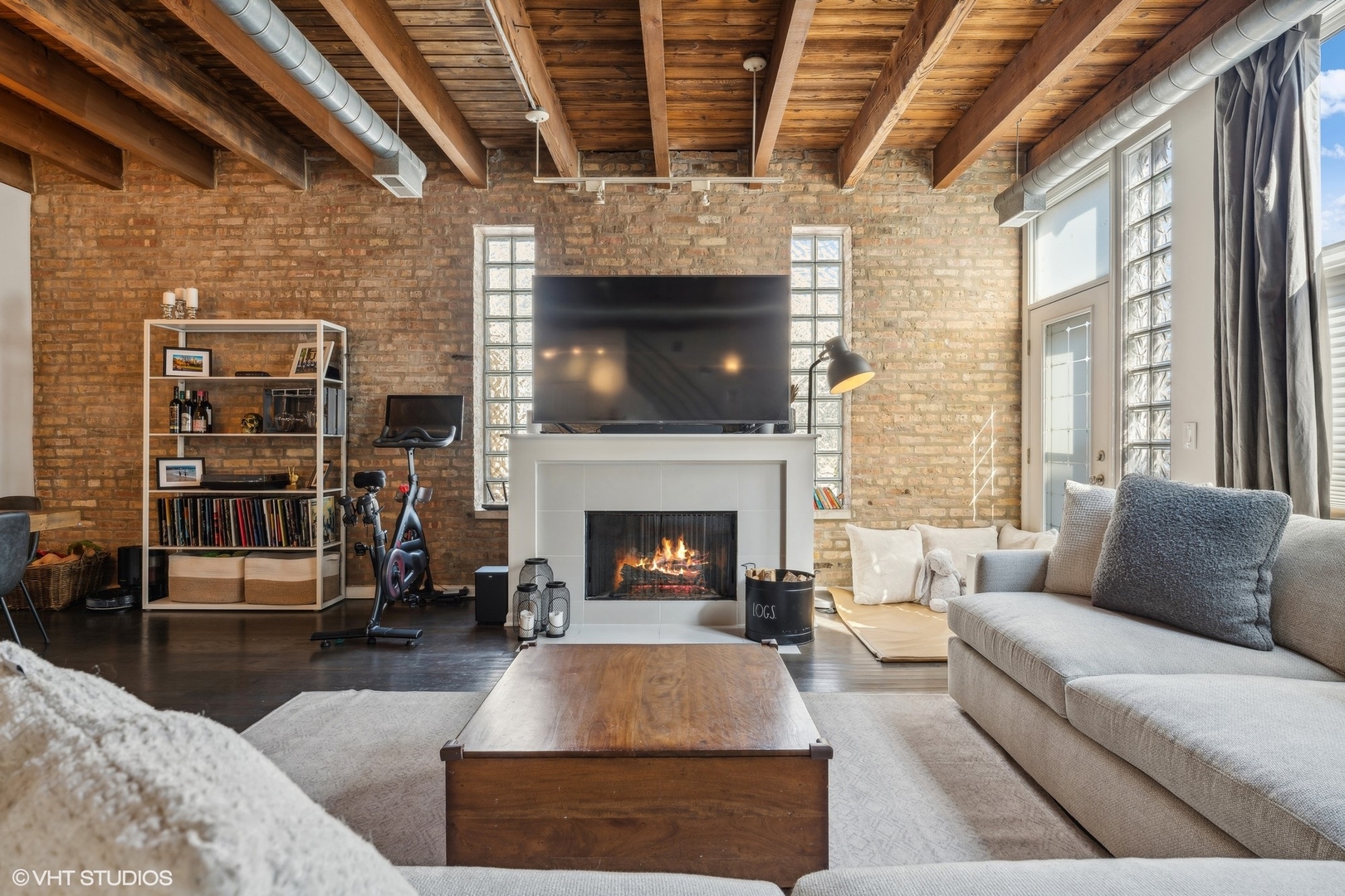 1235 West George Street, Unit 215 Chicago, IL 60657 - Photo 2 of 25 a living room with furniture and a fireplace