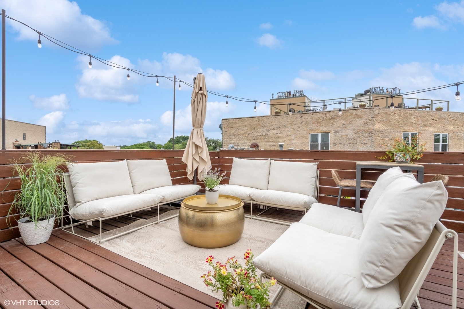 1235 West George Street, Unit 215 Chicago, IL 60657 - Photo 21 of 25 a view of a terrace with couches and potted plants