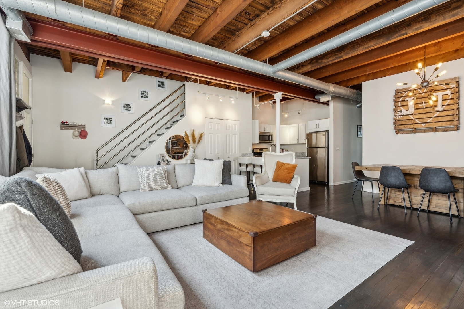 1235 West George Street, Unit 215 Chicago, IL 60657 - Photo 5 of 25 a living room with furniture and a table
