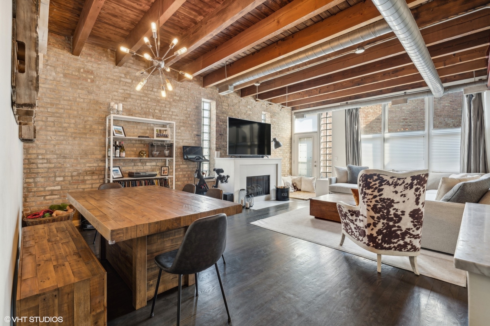 1235 West George Street, Unit 215 Chicago, IL 60657 - Photo 6 of 25 a living room with furniture and a flat screen tv