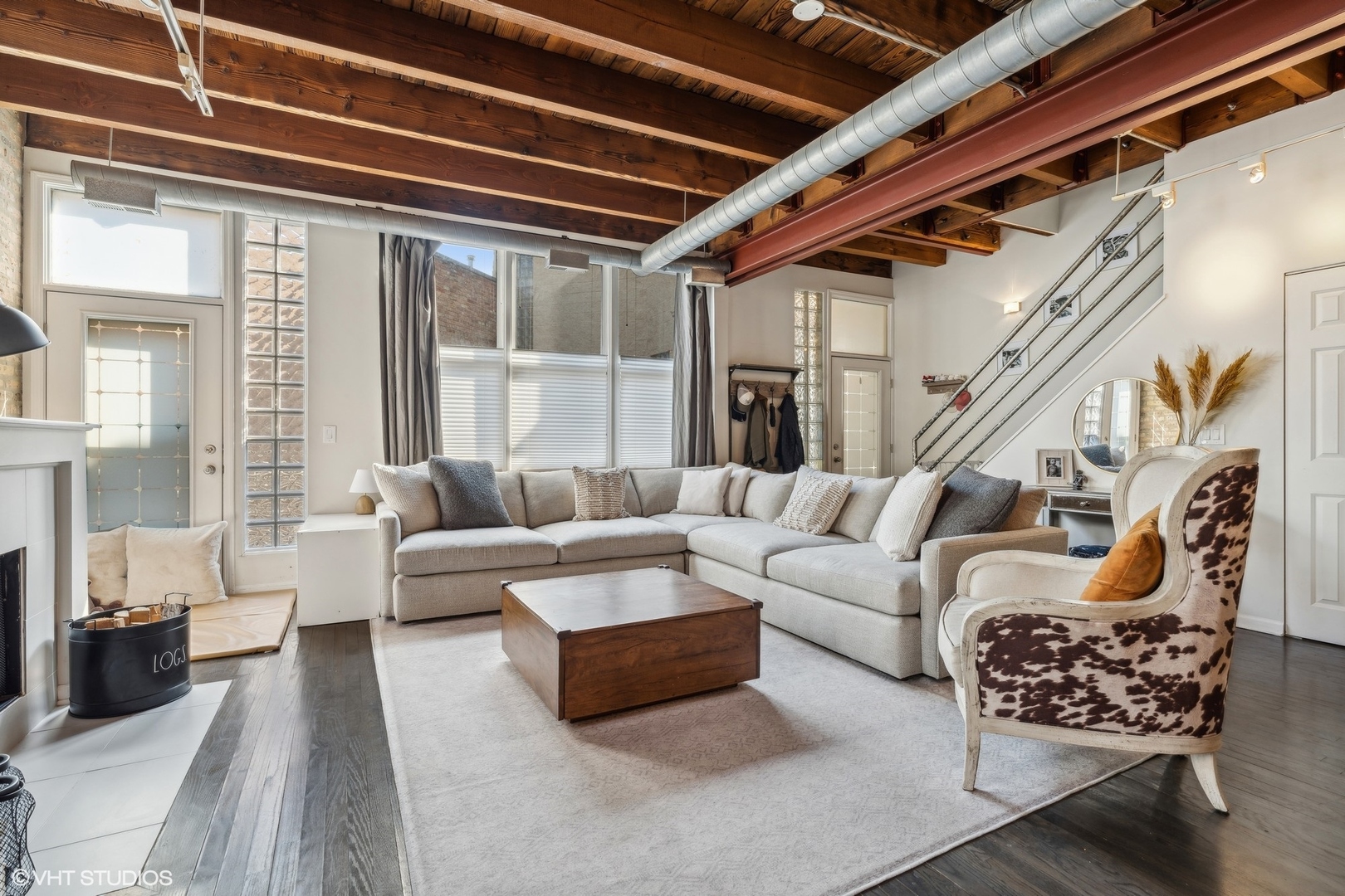 1235 West George Street, Unit 215 Chicago, IL 60657 - Photo 8 of 25 a living room with furniture and a large window