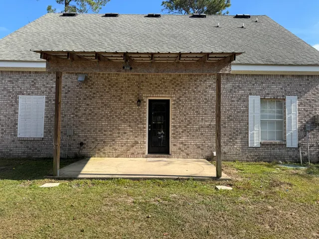 a view of a house with a small yard