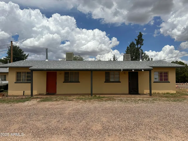 a front view of a house with yard