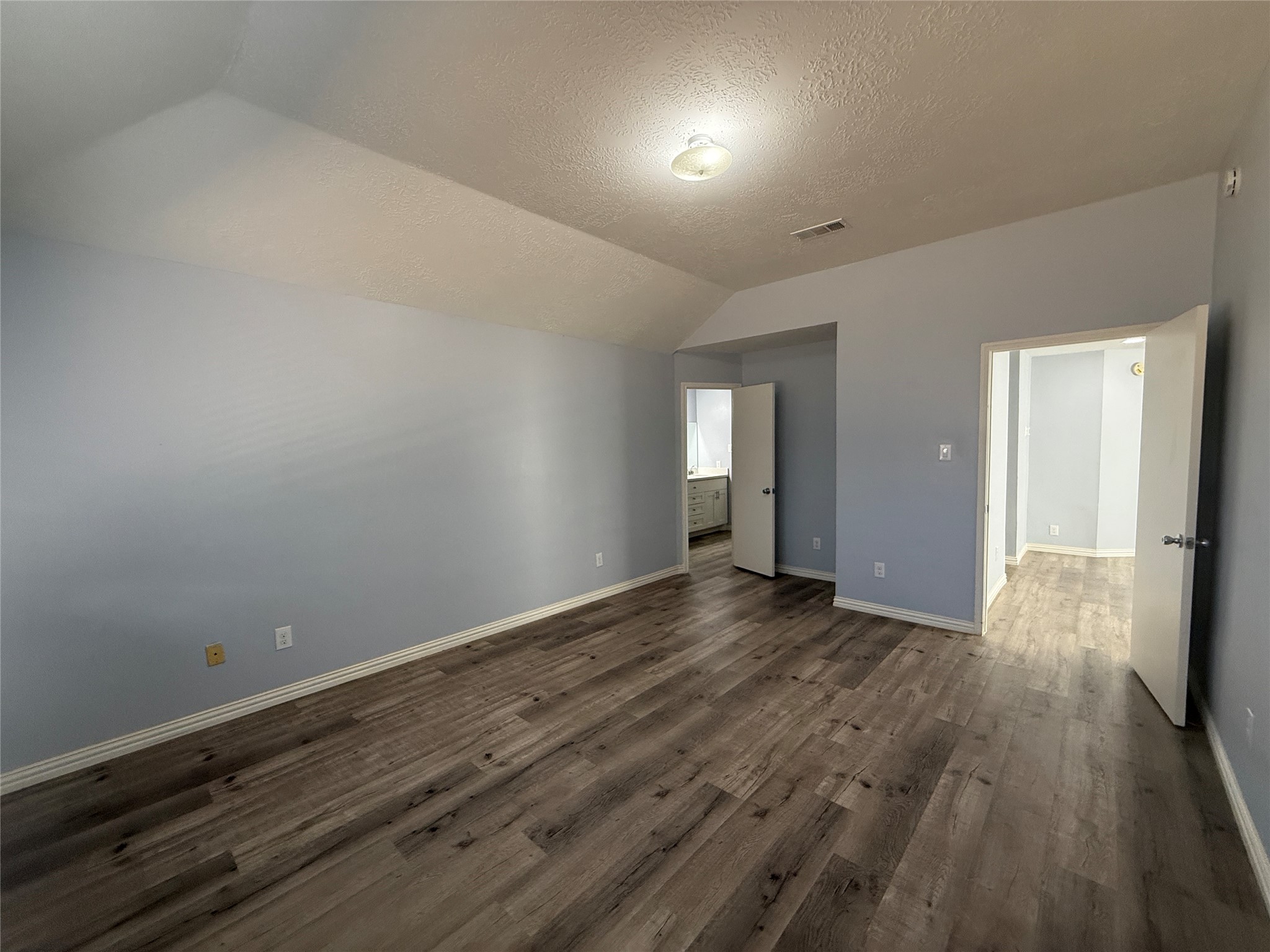 19614 Azalea Valley Drive Katy, TX 77449 - Photo 14 of 27 an empty room with wooden floor and windows