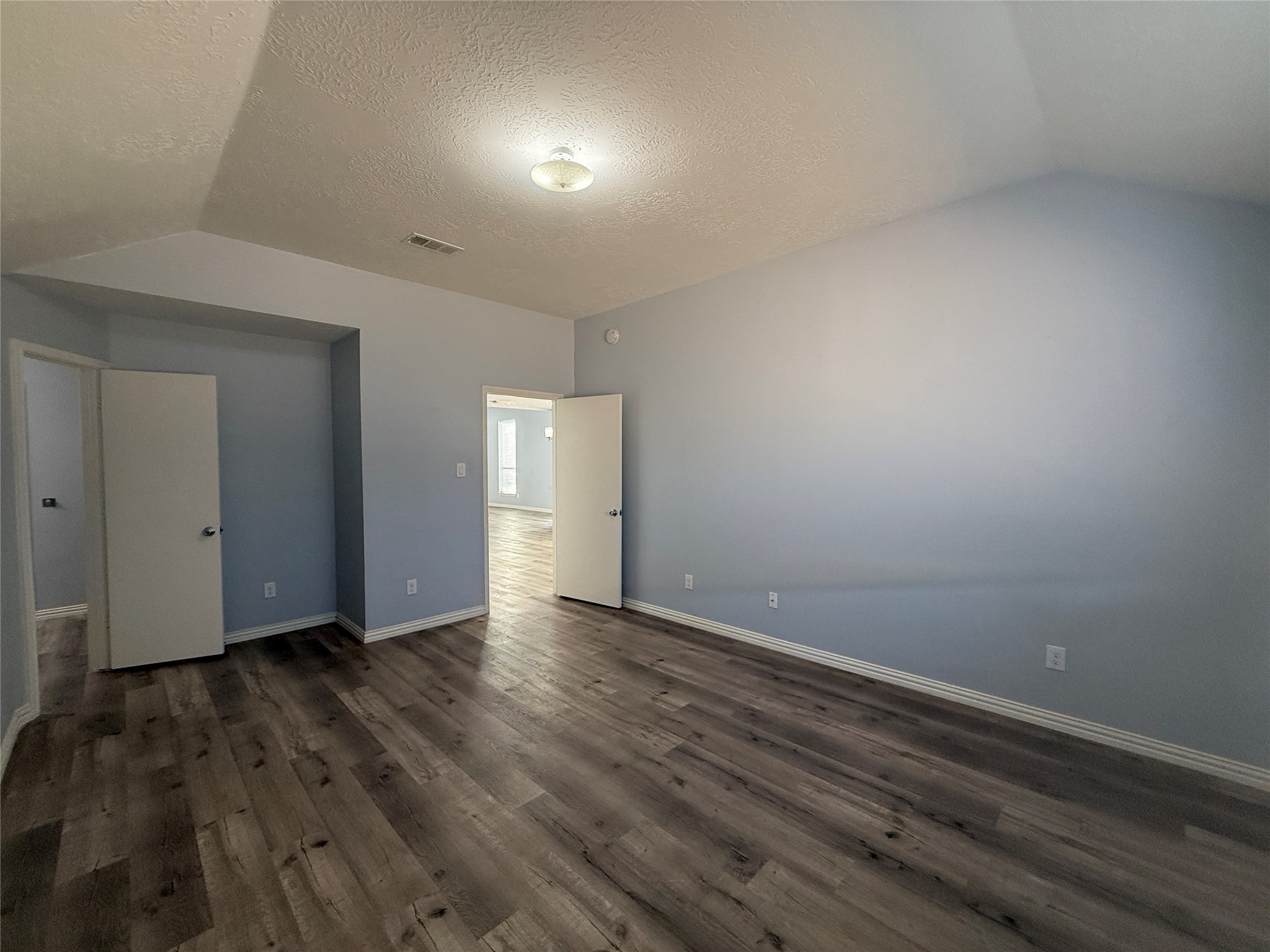 19614 Azalea Valley Drive Katy, TX 77449 - Photo 15 of 27 a view of an empty room with wooden floor