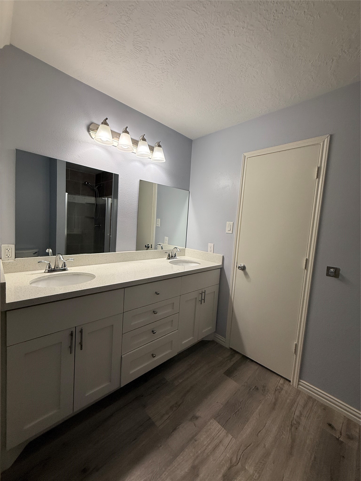 19614 Azalea Valley Drive Katy, TX 77449 - Photo 16 of 27 a bathroom with a double vanity sink and mirror
