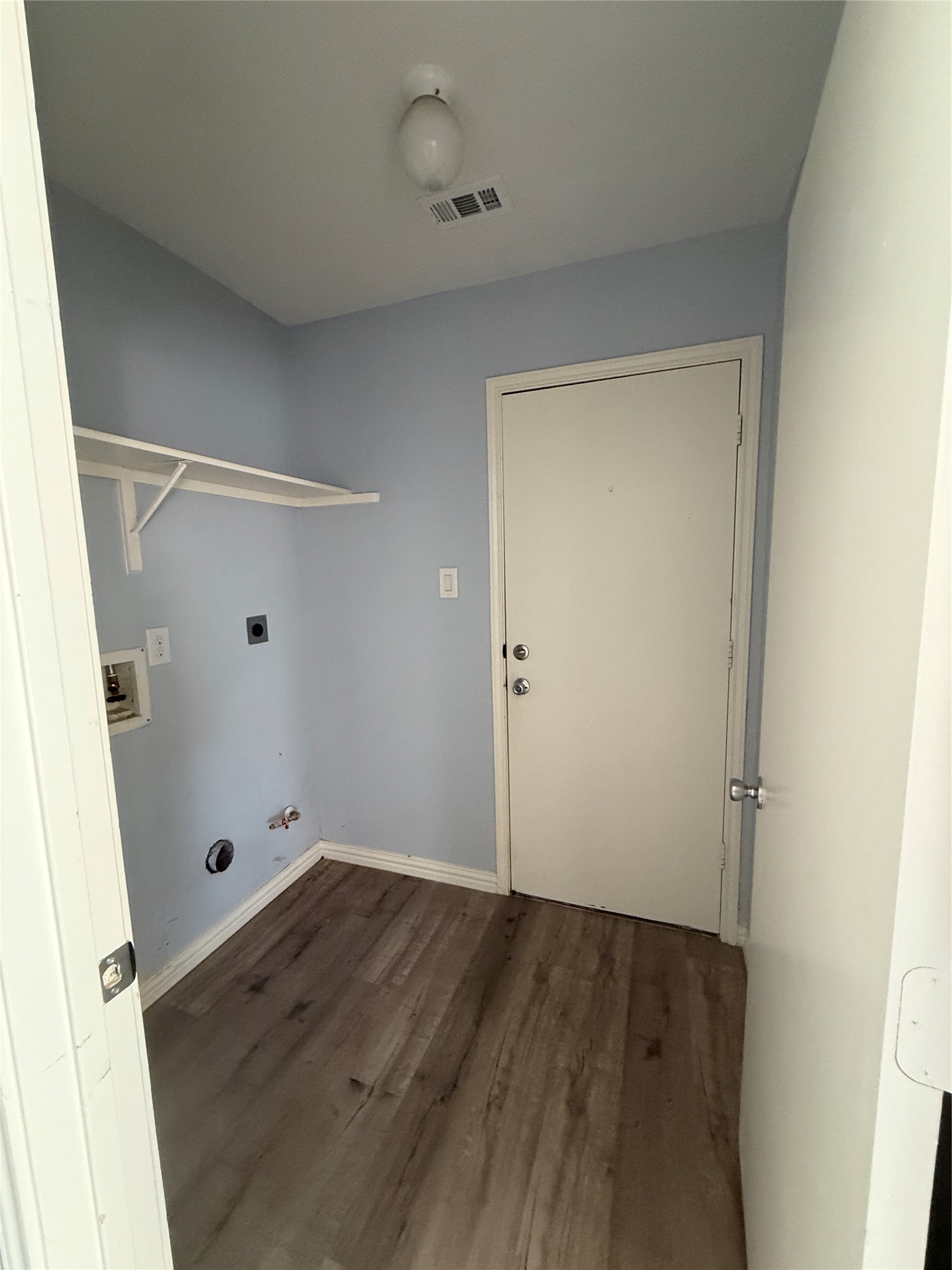 19614 Azalea Valley Drive Katy, TX 77449 - Photo 17 of 27 an empty room with wooden floor and mirror