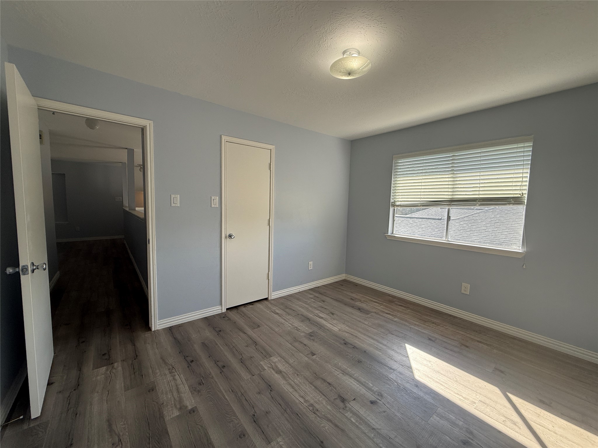 19614 Azalea Valley Drive Katy, TX 77449 - Photo 23 of 27 wooden floor in an empty room with a window