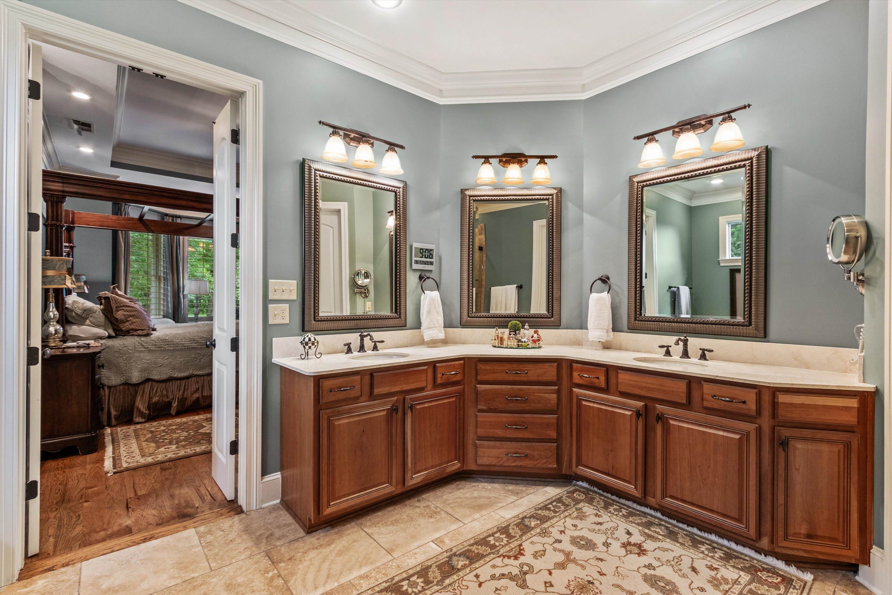 150 Ridgecrest Drive Arlington, TN 38002 - Photo 21 of 40 Dual vanities featuring wood cabinetry and light-toned countertops