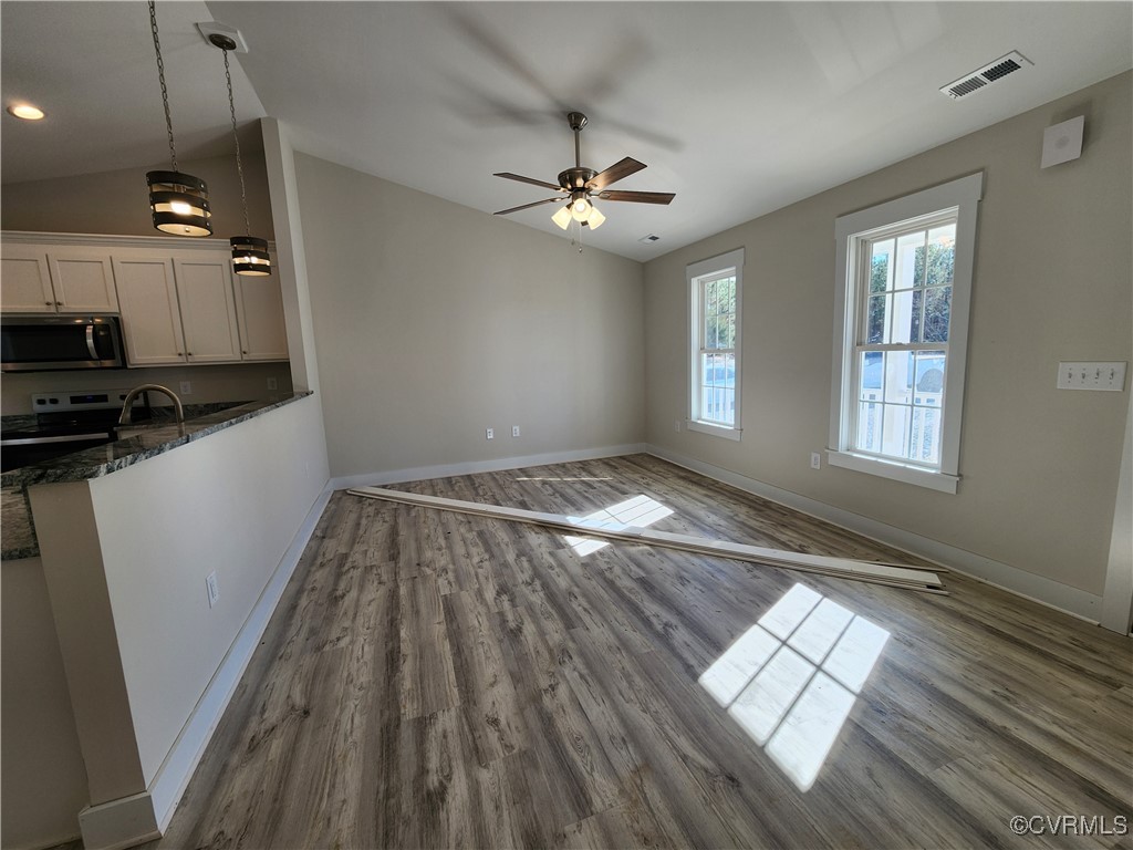 2495 Indian Neck Road Tappahannock, VA 22560 - Photo 7 of 27 Unfurnished living room featuring hardwood / wood-