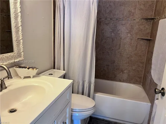 a bathroom with a sink toilet and bathtub