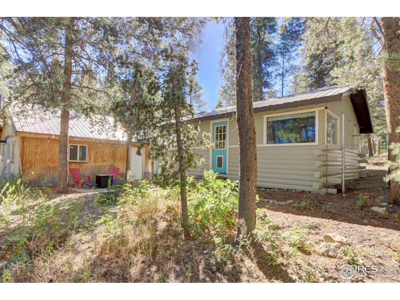 106 Dos Lobos Black Hawk, CO 80422 - Photo 5 of 27 Nicely wooded lot with fenced area for the pooches.