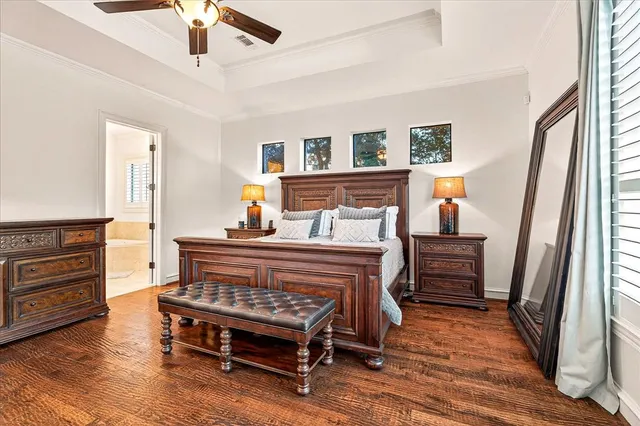 a bedroom with furniture and wooden floor