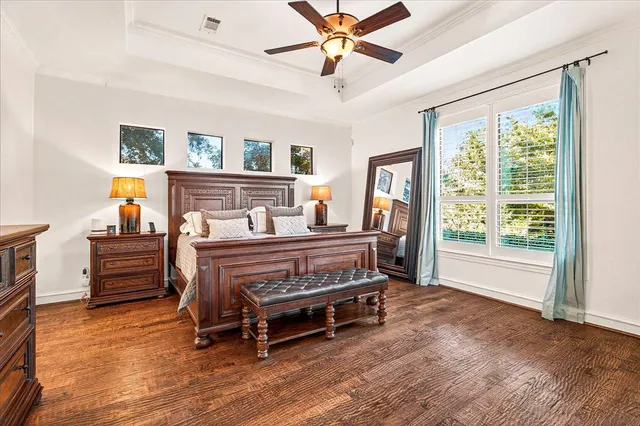 a spacious bathroom with a tub sink and mirror
