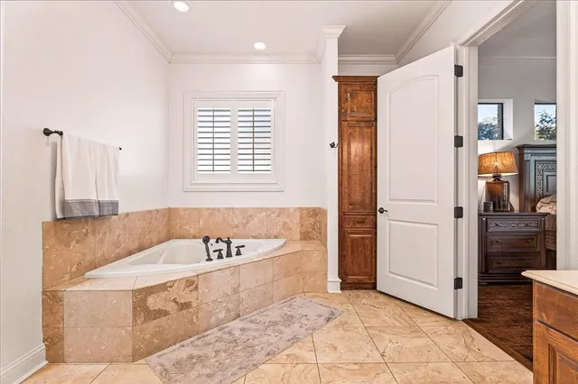 a spacious bathroom with a double vanity sink toilet and shower