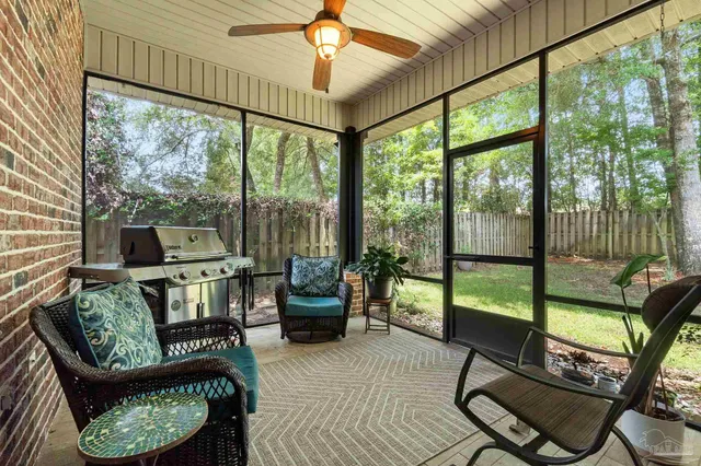 a view of a swimming pool with a patio and a yard