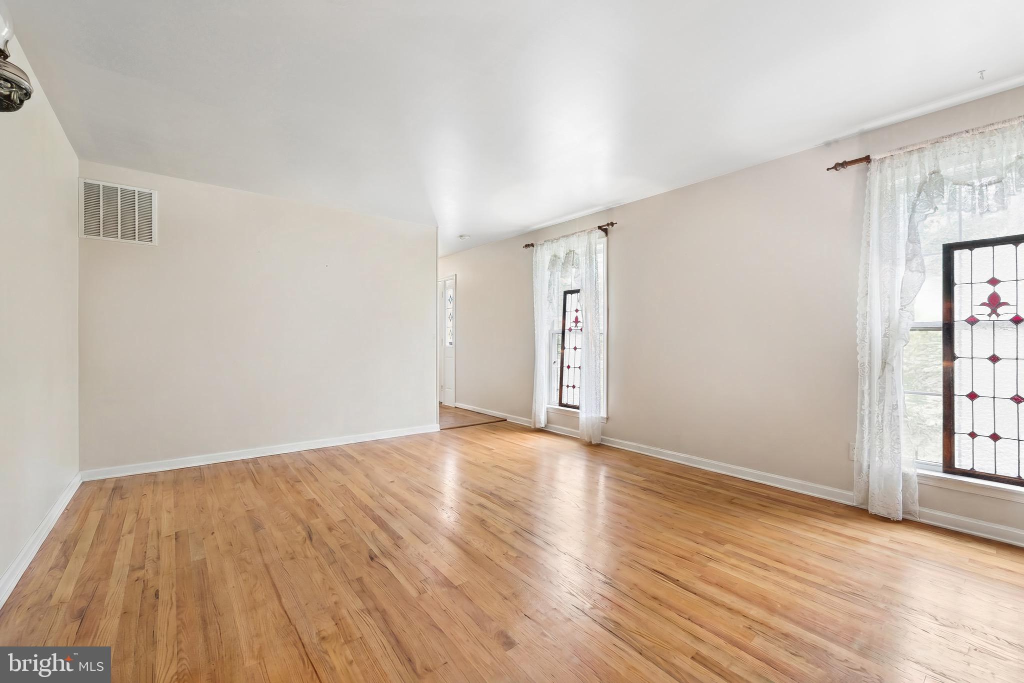 5099 Courtneys Corner Road Sumerduck, VA 22742 - Photo 8 of 73 a view of an empty room with wooden floor and window