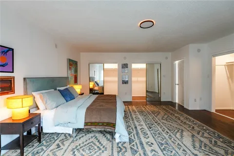 a bed room with a bed and a chair