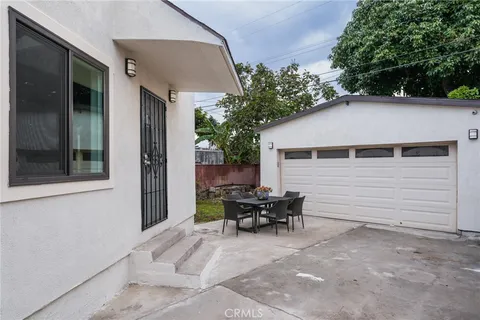 a view of house with outdoor seating space