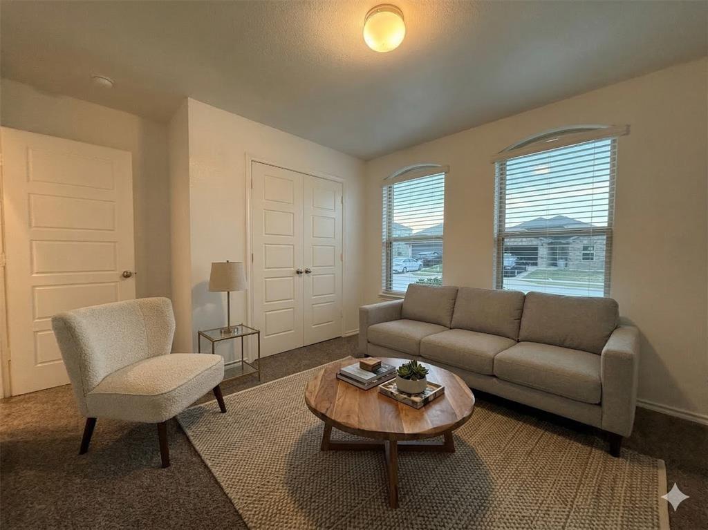 3149 Guyana Road Fort Worth, TX 76123 - Photo 5 of 9 a living room with furniture and a wooden floor