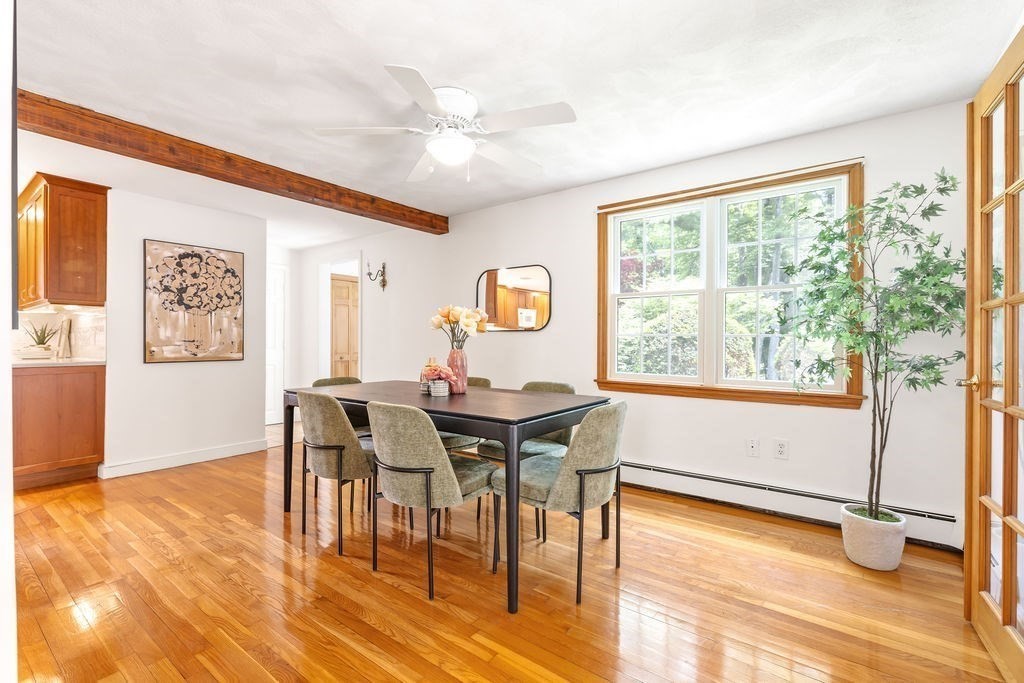 21 Vanderbelt Road Acton, MA 01720 - Photo 11 of 36 a view of a dining room with furniture window and wooden floor