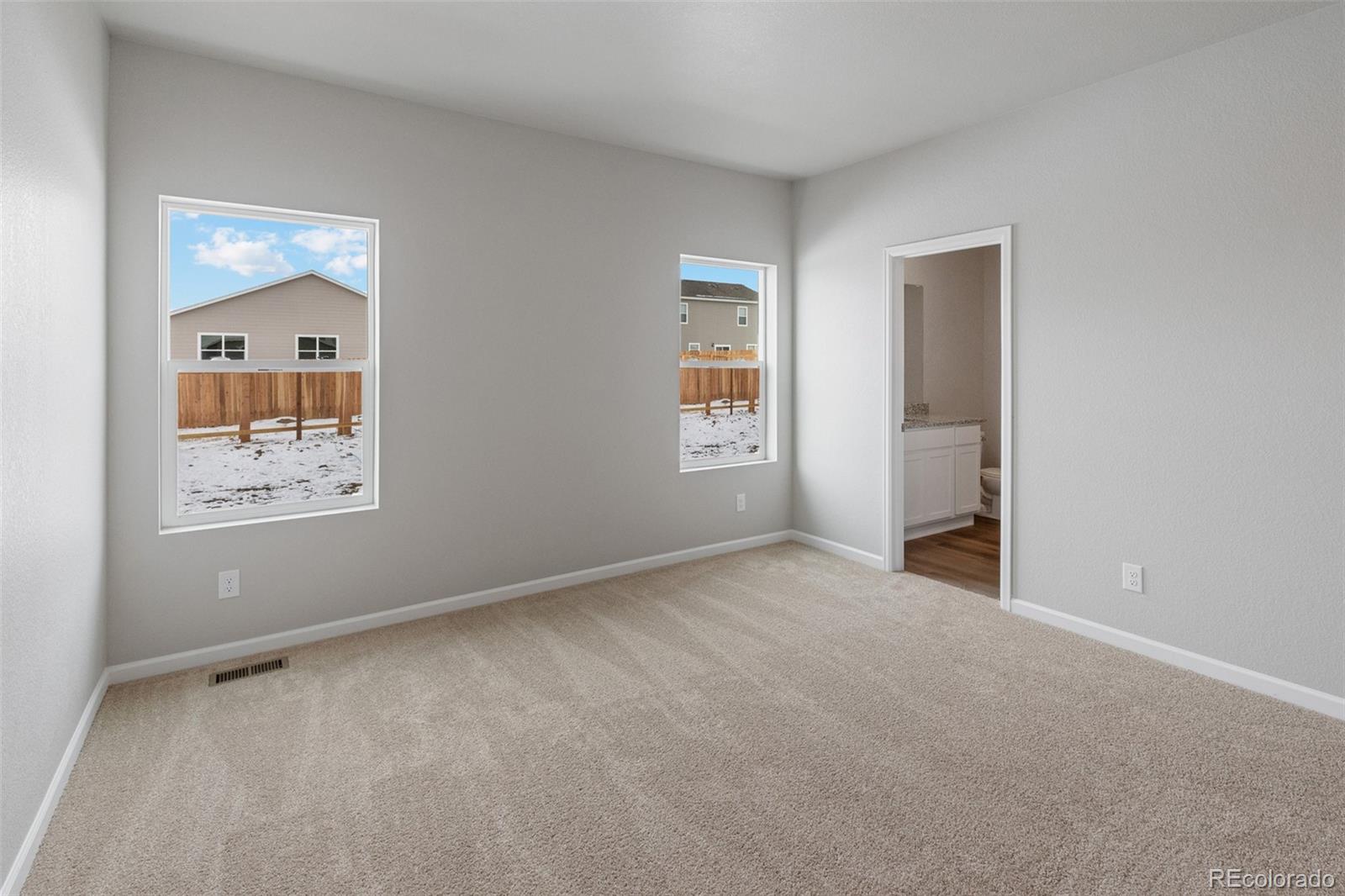2250 Christina Street Fort Lupton, CO 80621 - Photo 11 of 38 an empty room with windows