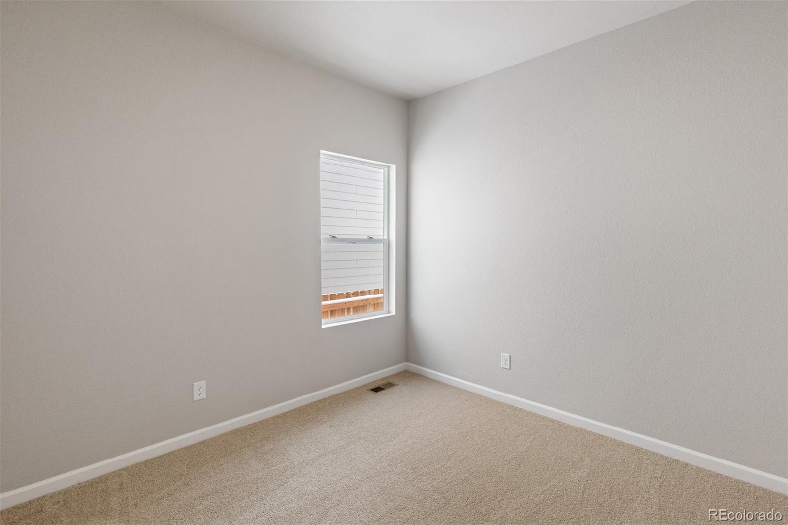 2250 Christina Street Fort Lupton, CO 80621 - Photo 15 of 38 an empty room with a window
