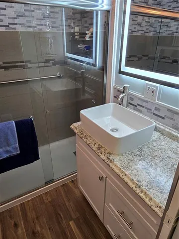 a bathroom with a sink and a mirror