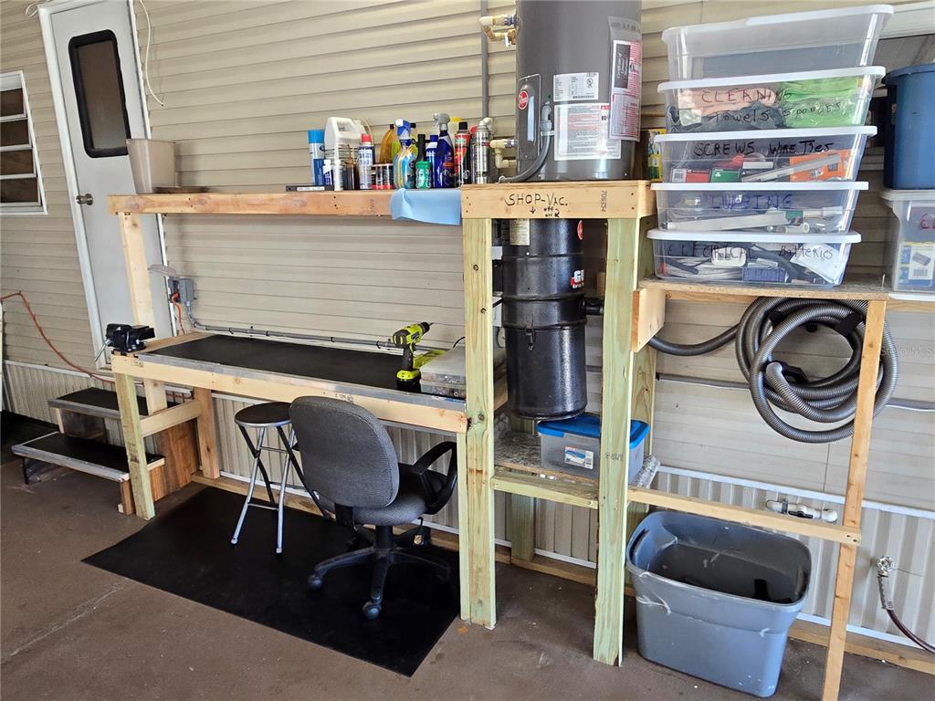 2043 Ketch Circle Palm Harbor, FL 34683 - Photo 20 of 32 a bathroom with a sink a mirror and shower