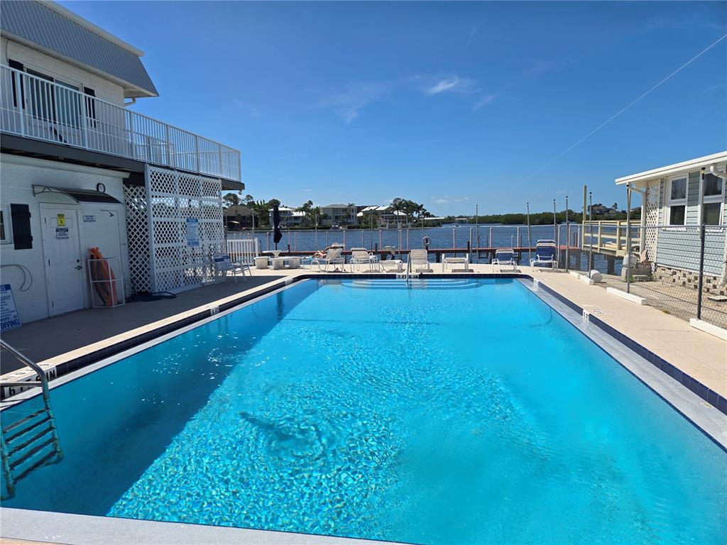 2043 Ketch Circle Palm Harbor, FL 34683 - Photo 30 of 32 a view of a kitchen with swimming pool