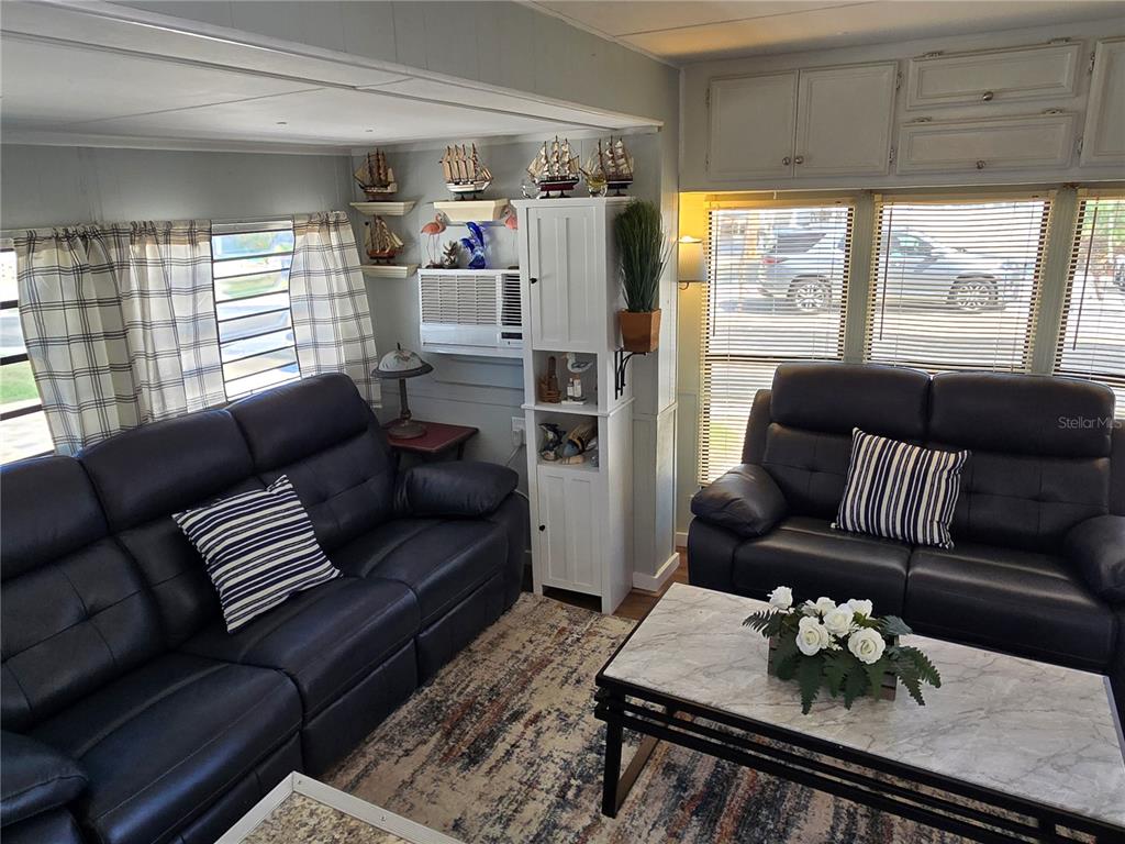 2043 Ketch Circle Palm Harbor, FL 34683 - Photo 4 of 32 a living room with furniture and a window