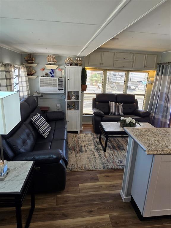 2043 Ketch Circle Palm Harbor, FL 34683 - Photo 9 of 32 a living room with furniture and wooden floor